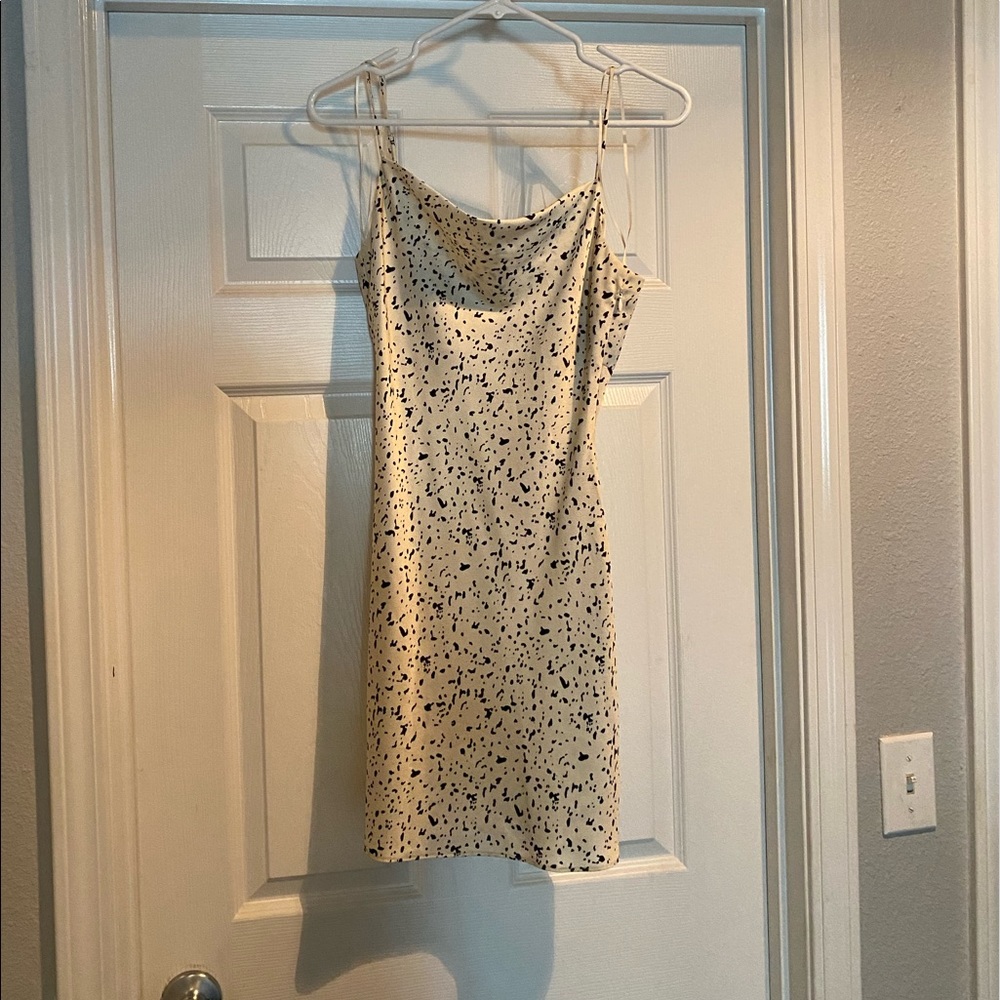 Small, slinky, Cream mini dress with cut out back